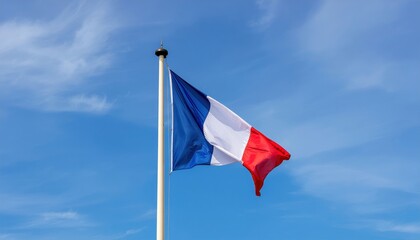 Flag of France waving over a blue sky