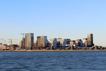 Naklejka premium The city is visible from afar on the river bank. 