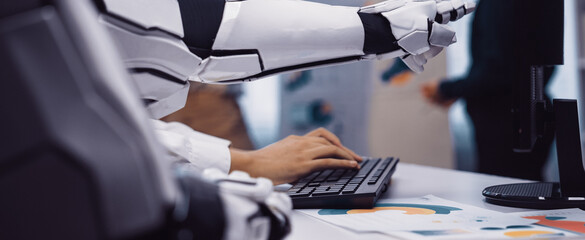 A robotic arm is seen interacting with a keyboard in a contemporary office, highlighting the...