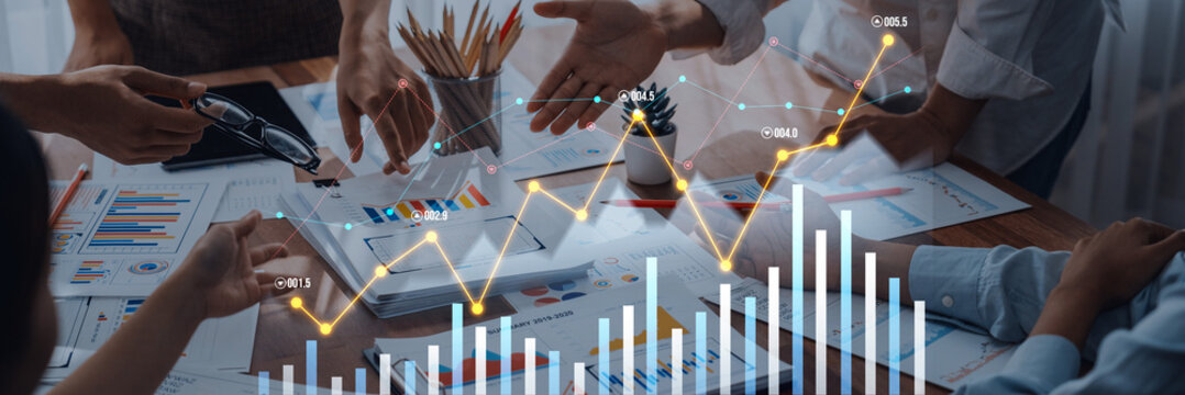 A business team collaborates in a meeting to analyze growth trends using charts and graphs. Explore teamwork, strategic planning, and data insights for successful projects. Scalp