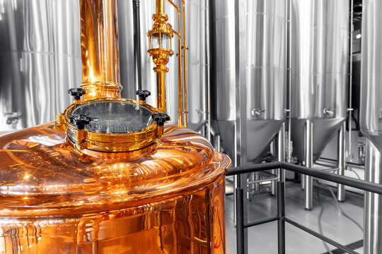 Shiny copper equipment in modern brewery factory with stainless steel tanks - Powered by Adobe