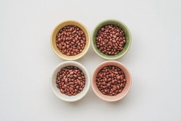 Aduki beans in colorful bowls on white background food photography concept