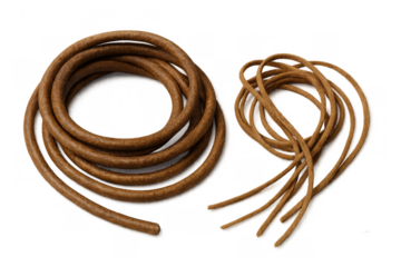 Coiled and tangled brown leather cords for handicraft and shoelace lacing material, transparent background