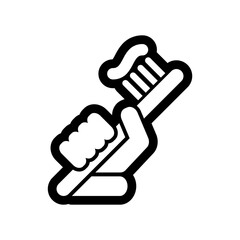 Hand holding toothpaste and toothbrush