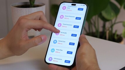 A persons hands navigate a digital insurance marketplace in slow motion, comparing different types and offers to find the most suitable coverage. This clip is perfect for demonstrating consumer