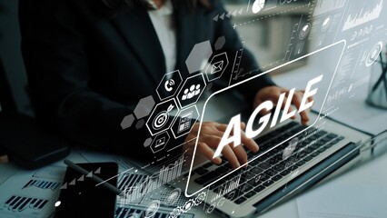 Business Professional Using Laptop with Agile Concept and Digital Interface Overlays in Modern Office Environment. Asymptotic smart data analytic.
