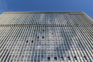 modern urban multi-storey building, on the background of blue sky, background