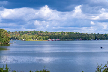 Calm Lake Landscape Under Dramatic Clouds