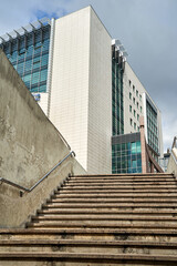 Concrete stairs leading to a modern residential building in Poznan