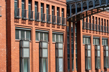 Restored old brewery and metal footbridge in Poznan