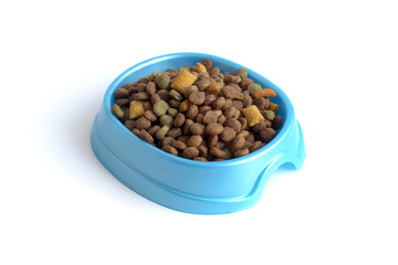 There is a bowl of dry pet food on a white background.
