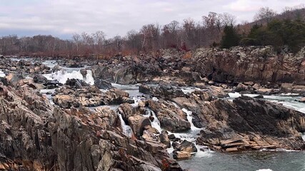 great falls in virginia, amazing waterfalls during winter, breathtaking views of frozen falls, beautiful scenes of winter landscapes, captivating images of cascading water, serene moments in nature's 