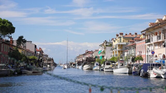 Sunny Boat Traffic on the Canal in Grado, Italy