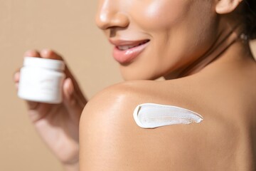 Woman applying body cream for skincare routine and healthy skin concept
