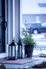 Winter porch with lanterns and evergreen plant creating cozy holiday decoration concept of christmas and new year home styling exterior decor inspiration