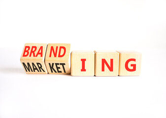 Branding and marketing symbol. Concept words Marketing to Branding on beautiful wooden cubes. Beautiful white table white background. Business branding and marketing concept. Copy space.