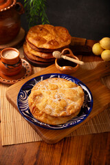 Buñuelos de rodilla. Traditional food at Christmas and winter holidays in Mexico, these are fried dough flour sprinkled with sugar or covered in a syrup made with piloncillo, cinnamon, and guava. POV