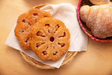 Buñuelos de viento. Traditional food at Christmas and winter holidays in Mexico, these are fried dough flour sprinkled with sugar or covered in a syrup made with piloncillo, cinnamon, and guava.