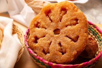 Buñuelos de viento. Traditional food at Christmas and winter holidays in Mexico, these are fried dough flour sprinkled with sugar or covered in a syrup made with piloncillo, cinnamon, and guava.