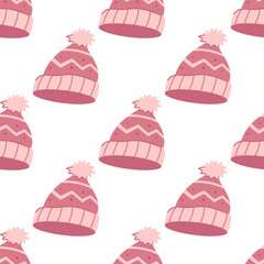 A cute winter seamless pattern with pink warm knitted hats with pom pom.