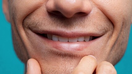 Close-up of a man's perfect smile with white teeth