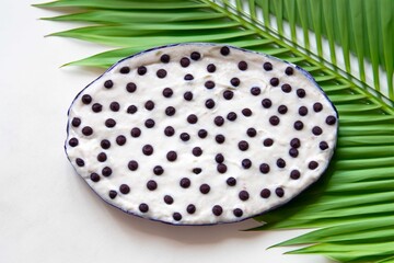 Traditional exotic cupuaçu mousse and cupuaçu cream, with chocolate chips, a sweet dessert from the Brazilian Amazon region.