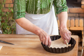 Rural Moldovan Grandma Preparing Traditional Homemade Cheese Pastry. Authentic Village Cooking. Healthy Old Customs in Moldova.
