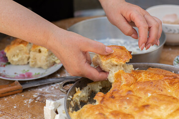 Rural Moldovan Grandma Preparing Traditional Homemade Cheese Pastry. Authentic Village Cooking. Healthy Old Customs in Moldova.
