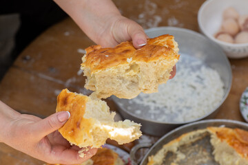 Rural Moldovan Grandma Preparing Traditional Homemade Cheese Pastry. Authentic Village Cooking. Healthy Old Customs in Moldova.
