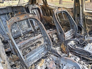 Burnt cars in parking lot, the car interior burned. Russia s war against Ukraine, drone attack on Ukrainian city Dnipo