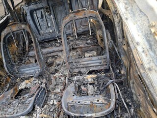 Burnt cars in parking lot, the car interior burned. Russia s war against Ukraine, drone attack on Ukrainian city Dnipo