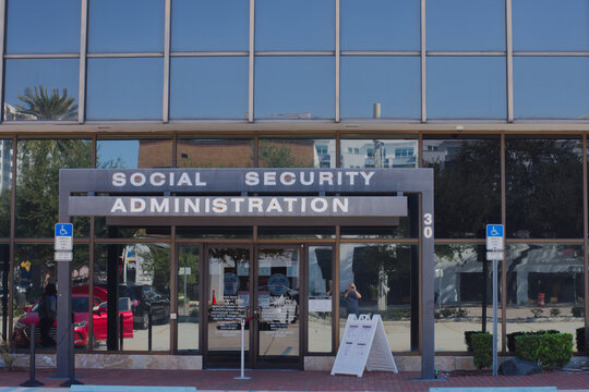 Social Security Administration Building Entrance With Glass Facade And Accessibility Signage In Downtown Office Complex. Editorial Use Only November 18, 2025, St. Petersburg, FL USA. 
Modern governmen