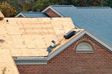 Multifamily dwelling roof replacement with a shallow depth of field © clsdesign