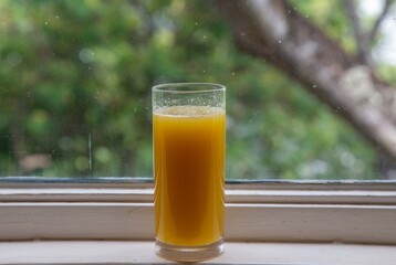 Fresh Sugarcane Juice with Lime on Sugarcane Stalks