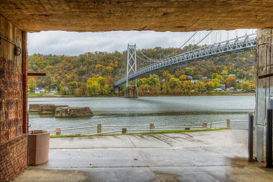 Simon Kenton Memorial Bridge.  A captivating photograph taken from a tunnel passing under a railroad, showcases this historic cantilevered through truss bridge. 