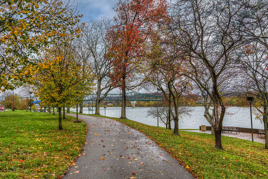 David Harris Riverwalk A hiking trail following the Ohio River in Huntington WV on a rainy October afternoon.  Heading to the Robert C. Byrd Bridge.
