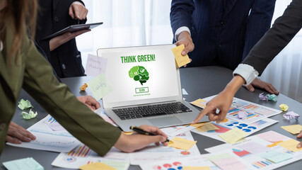 Analyst team use sticky note for creative and analytic brainstorm for business idea with BI data dashboard on laptop screen. Analysis financial data visualization tech for marketing strategy. Prodigy