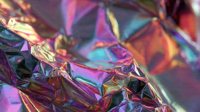 A vibrant, close-up abstract of crumpled iridescent foil, showcasing a mesmerizing spectrum of holographic colors and dynamic light reflections.