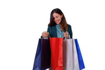 Woman smiling while holding multiple shopping bags, enjoying consumerism and sale purchases