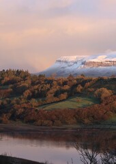 Snow covered Benbulben Mountain viewed from across Lough Colgagh on winter morning. County Sligo. Ireland
