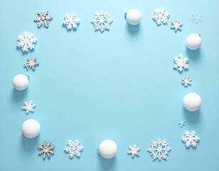 Fototapeta premium Festive Winter Snowflake and Snowball Border on Serene Blue Background.
