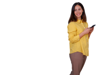 Young woman smiling happy, standing while holding and using a mobile phone, sending messages, with transparent background