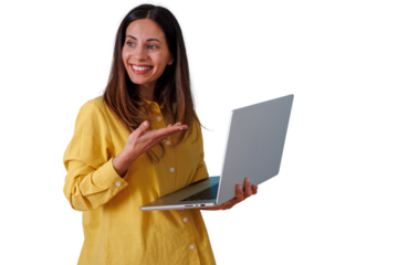 Smiling woman holding a laptop and gesturing with her hand, presenting business concepts, online learning, and digital solutions