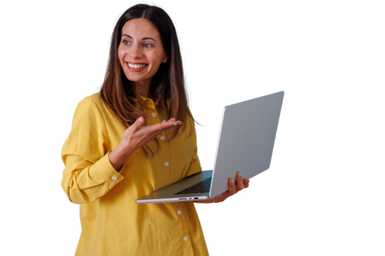 Smiling woman holding a laptop and gesturing with her hand, presenting business concepts, online learning, and digital solutions