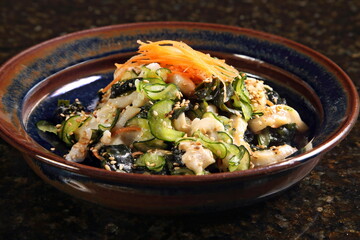 Sakana no shira-ae, a classic Japanese dish made with dried shiitake mushrooms, sugar, mirin, soy sauce, daikon radish, konnyaku, and carrots.