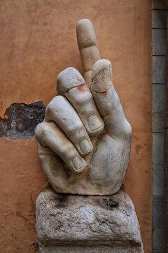 Close-up of a large marble hand sculpture with an upward pointing finger, displayed at the Museo Storico del Genio Militare in Rome, showing classical forms and Roman-inspired statuary