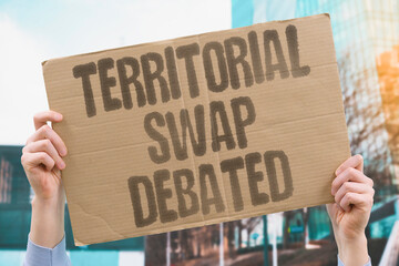"Territorial Swap Debated" Border adjustment proposal divides officials and citizens. PARTITION. EXCHANGE. REDISTRICTING. REDRAWING. REALIGNMENT.