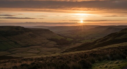 Obraz premium Golden sunset over a valley