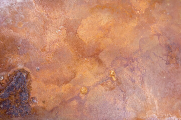 Rusty steel plate grunge texture varying hues of reddish-brown, orange, and dark brown. Surface is...