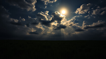 Wide grassland under moonlit sky filled with thick glowing clouds, rays of moonlight piercing through the clouds